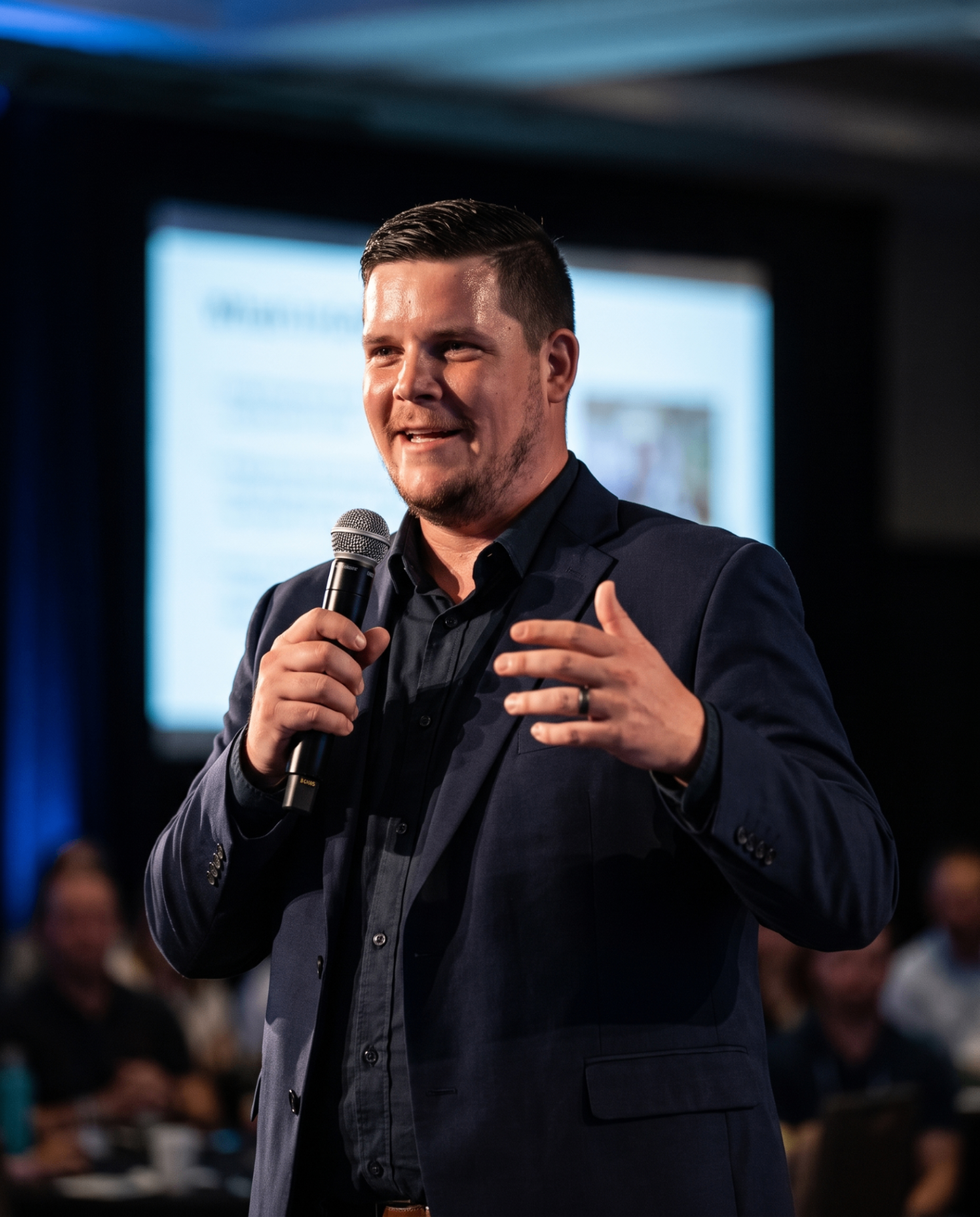 Michael Hawkins speaking on stage